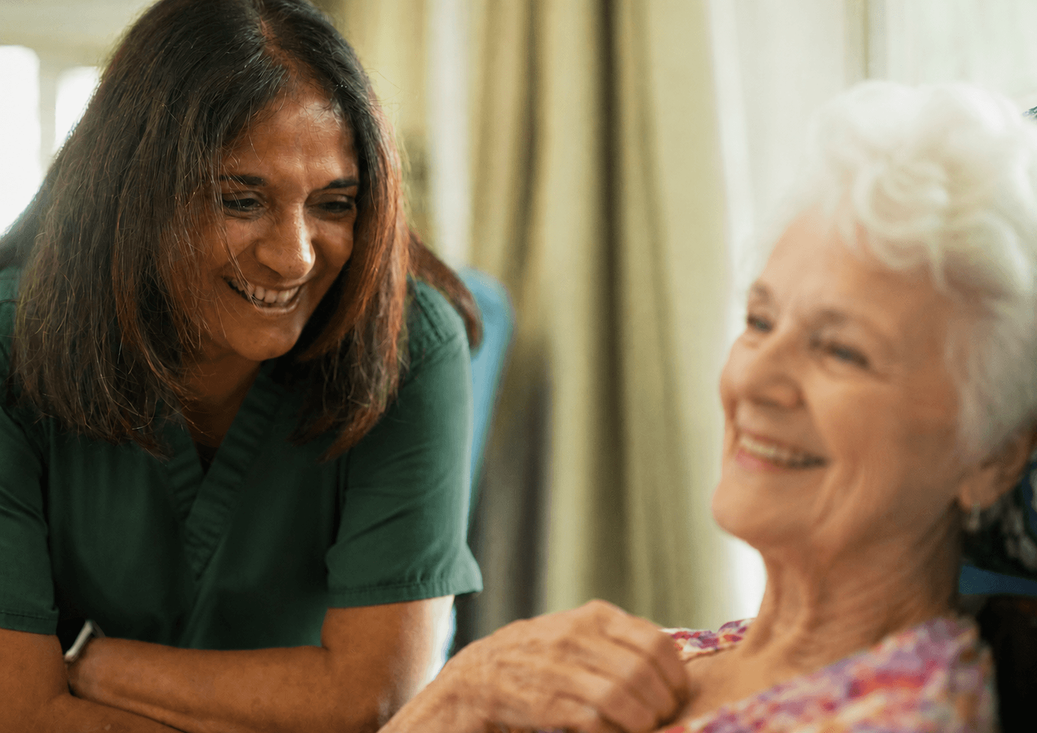 A serene and professional image of a caregiver and an elderly person sharing a warm moment in a beautifully lit, modern New Zealand home.
